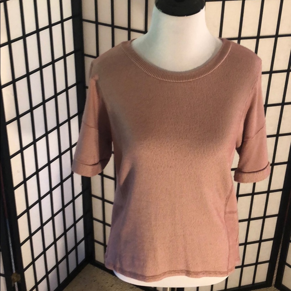 Extremely comfortable pink and white t-shirt.